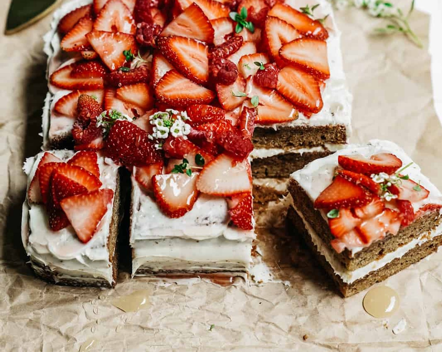 step 8 To the top cake, add more Coconut Whipped Topping (to taste), Creamed Honey (4 Tbsp), and then add Fresh Thyme (to taste) and gorgeous Fresh Strawberries (to taste) on top.