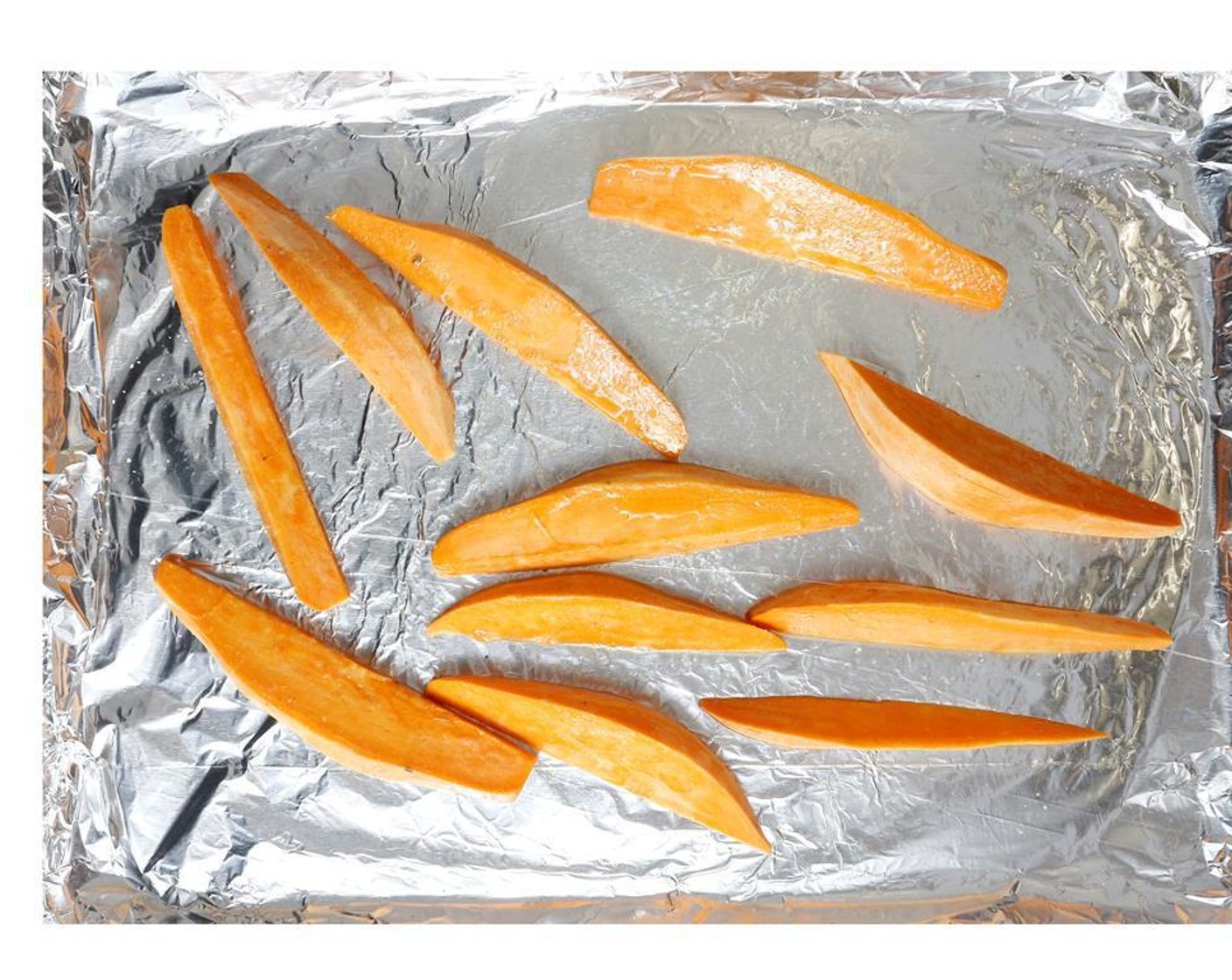step 3 Toss the sweet potato wedges with Olive Oil (1 Tbsp), Salt (to taste) and Ground Black Pepper (to taste). Spread out on a foil-lined baking sheet with the sliced red onion. Roast for 20 min, flip after 10 min.