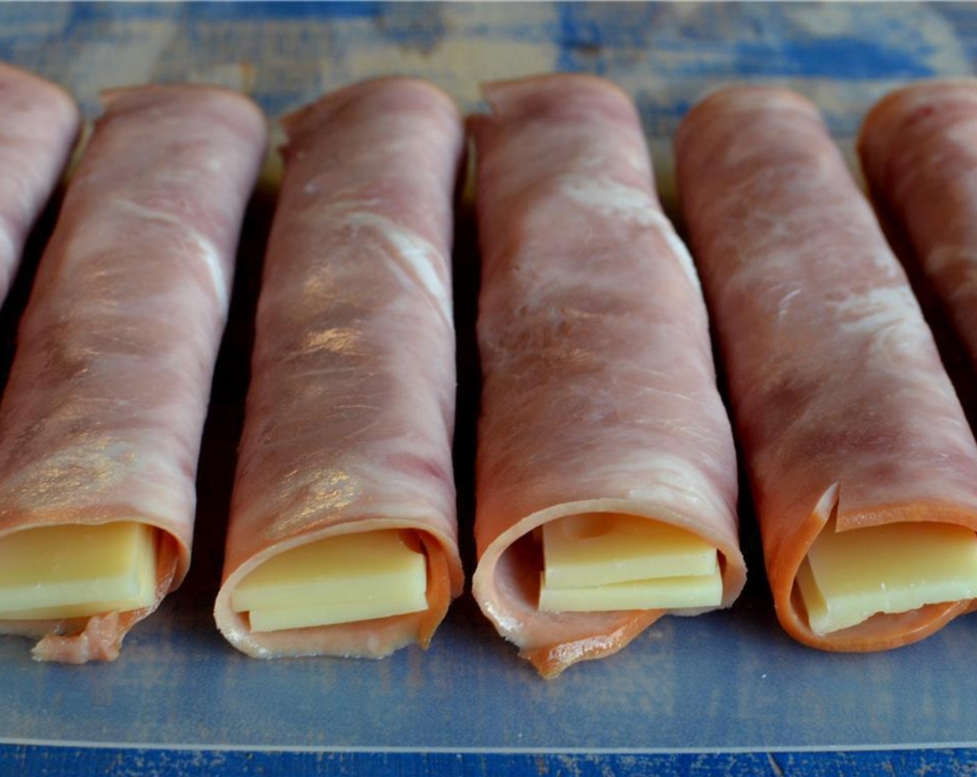 step 5 Start by rolling up some Swiss Cheese (8 slices) in the Deli Ham (8 slices).