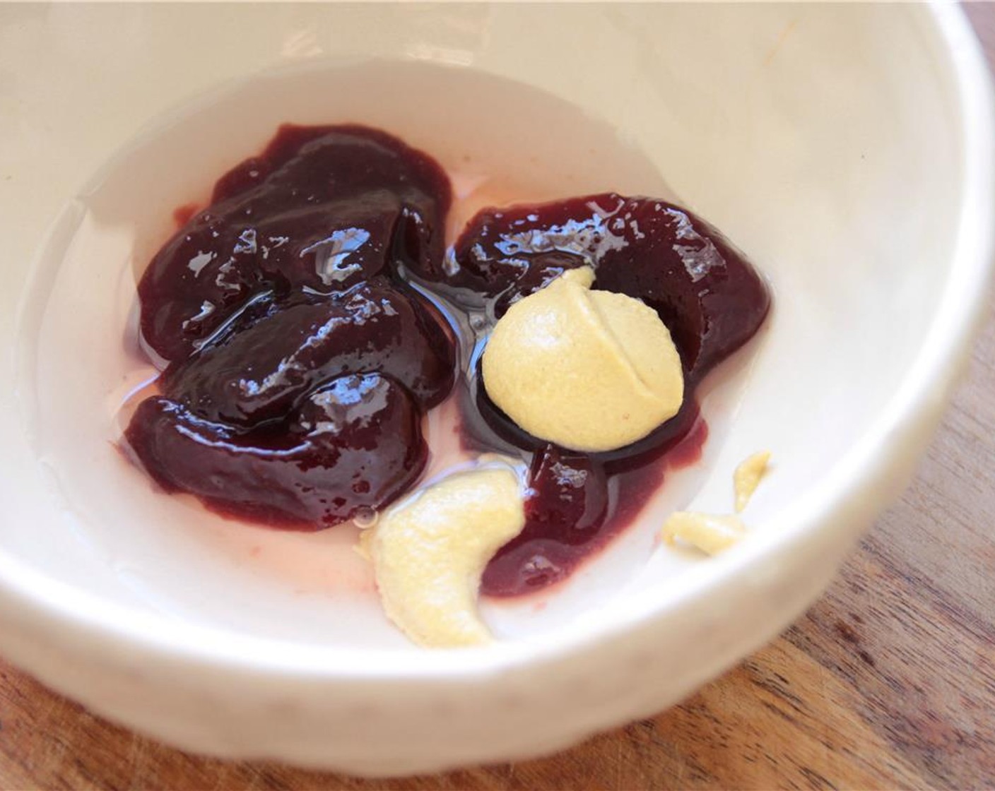 step 1 In a small bowl, whisk together the Seedless Raspberry Jam (3 Tbsp), White Wine Vinegar (2 Tbsp), and Dijon Mustard (1 tsp).