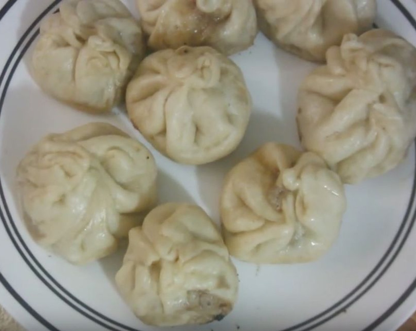 step 10 Flip baozi out onto a plate and serve. Careful, the filling might be hot if you serve them right away!