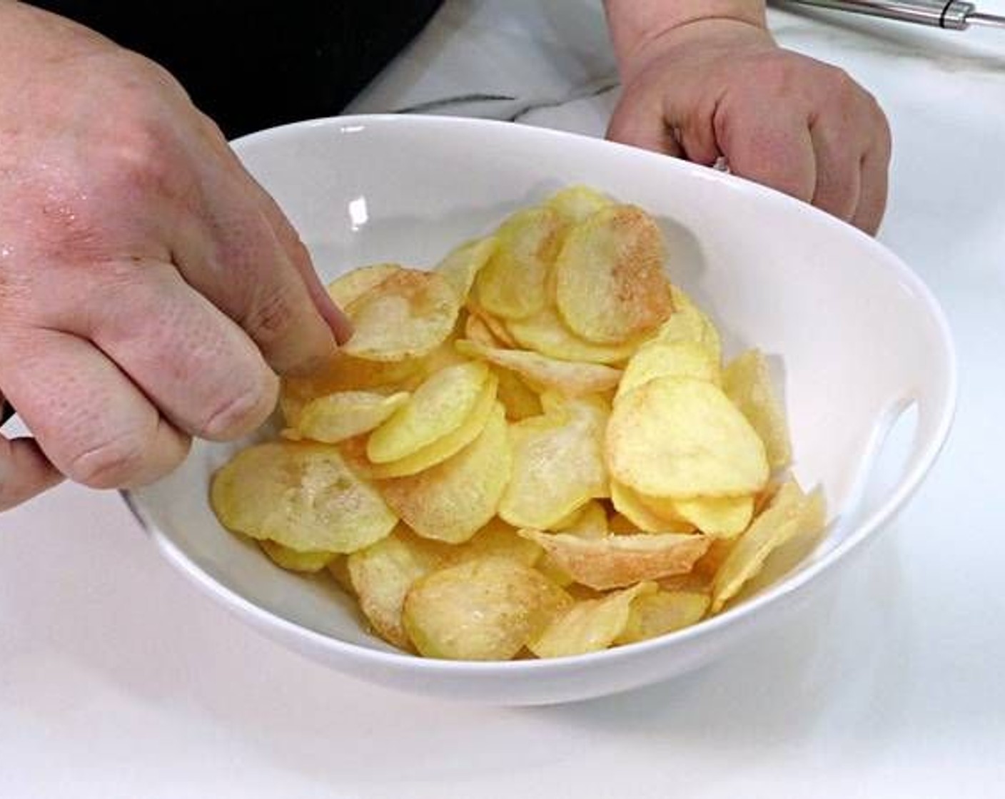 step 4 As they are finished frying, remove and place on a plate lined with paper towels to absorb the excess oil.