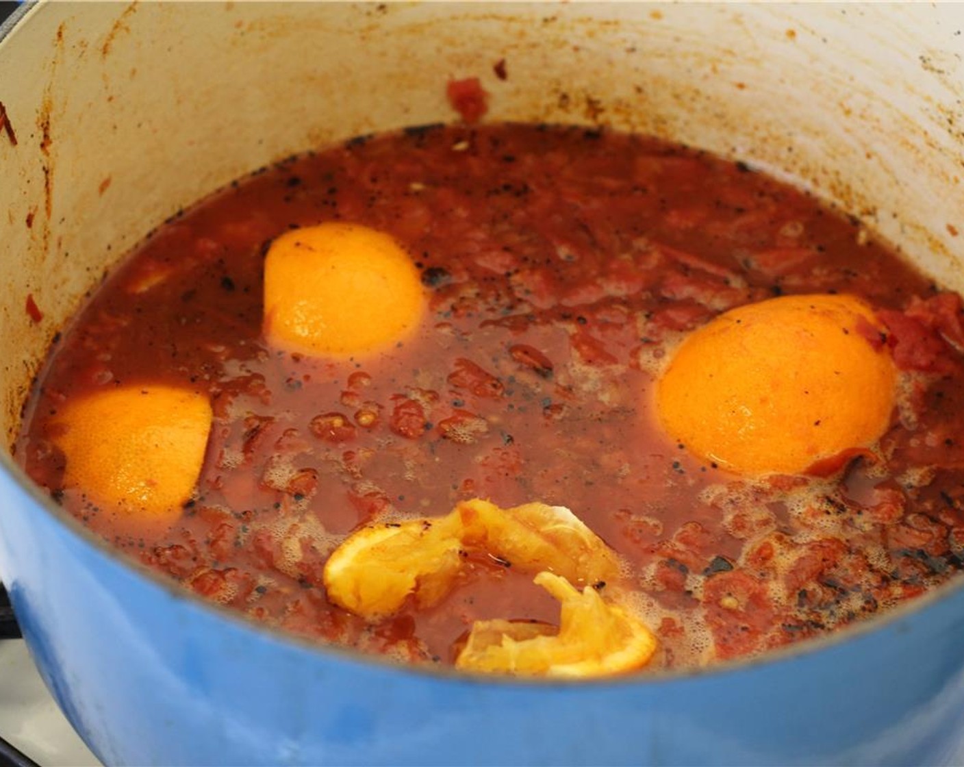 step 6 Turn up the heat to high and pour in the Beer (12 fl oz), Canned Fire Roasted Diced Tomatoes (1 2/3 cups), orange and lime juices, 3 tablespoons of liquid from the chipotle peppers in adobo sauce, Chipotle Peppers in Adobo Sauce (2) and the chopped orange.