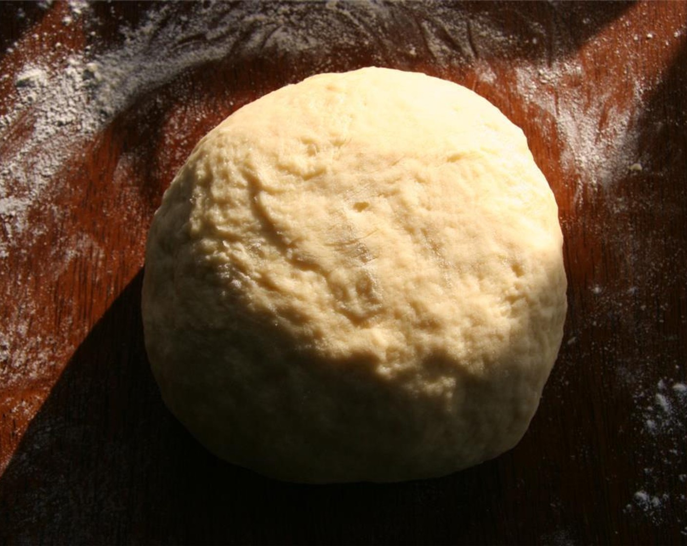 step 5 Add 1/3 cup of the reserved cooking liquid and add the Unbleached All Purpose Flour (2 1/2 cups), a little at a time, to form a dough. Turn the soft, moist dough out onto a lightly floured work surface. Knead until the dough feels smooth and elastic, about 5 minutes.