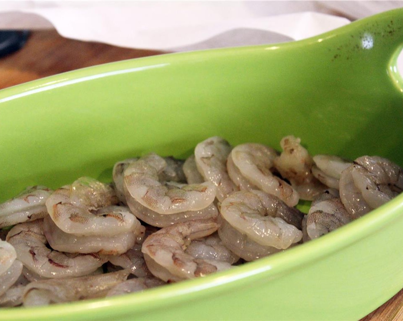 step 2 Preheat broiler to 450 degrees F (230 degrees C). Layer Shrimp (1 lb) in the bottom of a small baking dish.