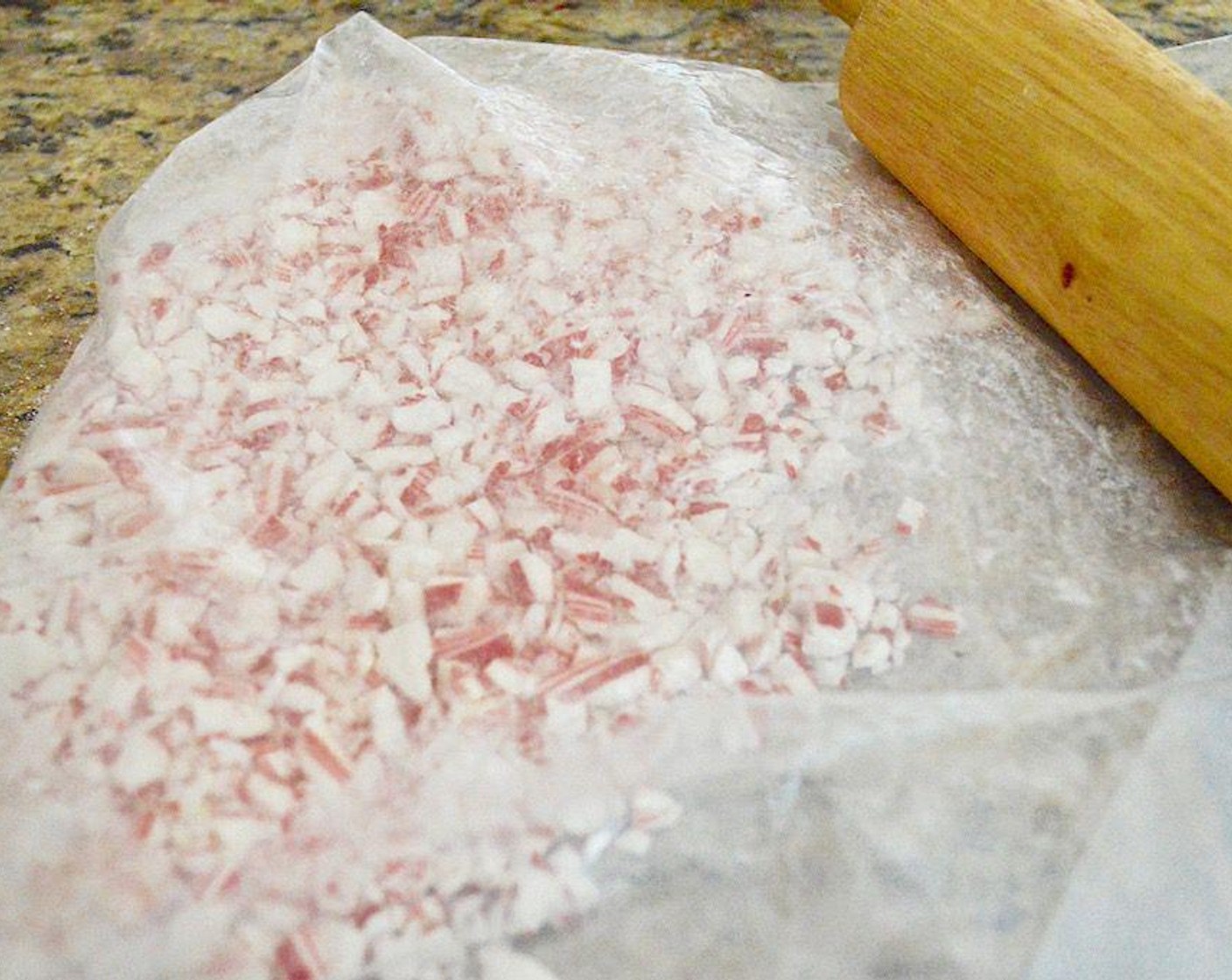 step 1 Put Candy Canes (12) in a sealable plastic bag and crush them into little pieces with a rolling pin. Set it aside.