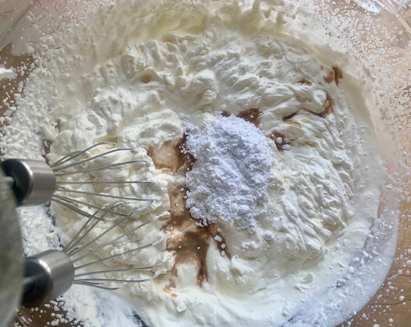 step 1 In a medium-size bowl, whip the Kemps Heavy Whipping Cream (2 cups) until they reach stiff peaks, then add the Powdered Confectioners Sugar (2 Tbsp) and Vanilla Extract (1 tsp). Mix on low until incorporated.