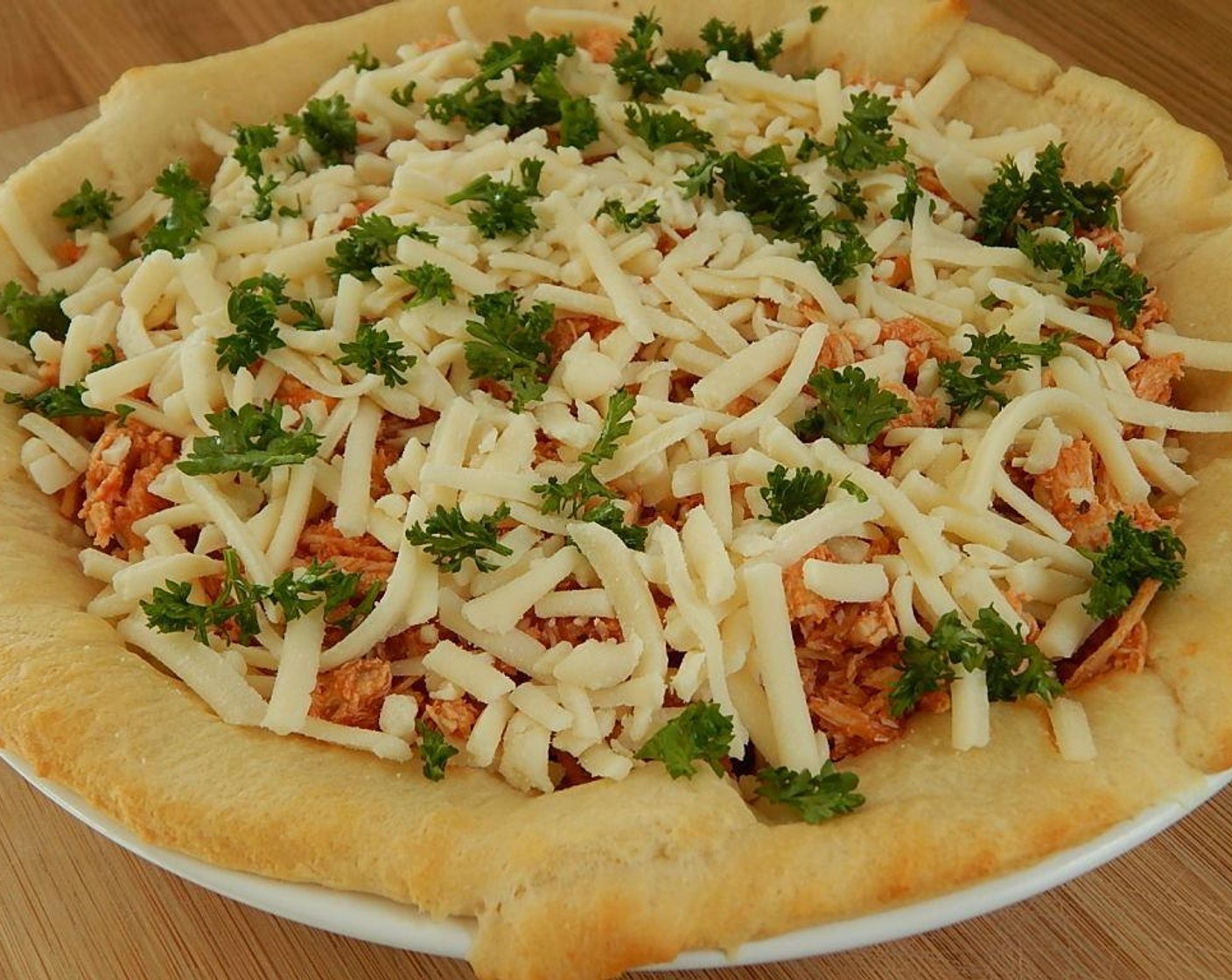 step 7 Sprinkle Shredded Light Mozzarella Cheese (2/3 cup) on top along with Fresh Parsley (to taste).