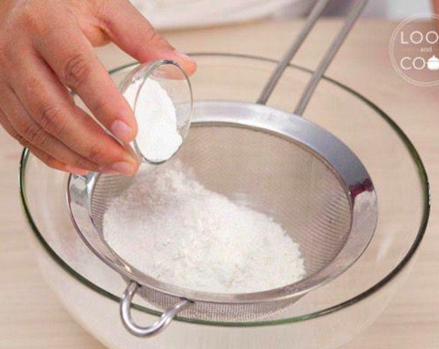 step 2 In a mixing bowl, shift All-Purpose Flour (1 cup) and Baking Powder (2 tsp).
