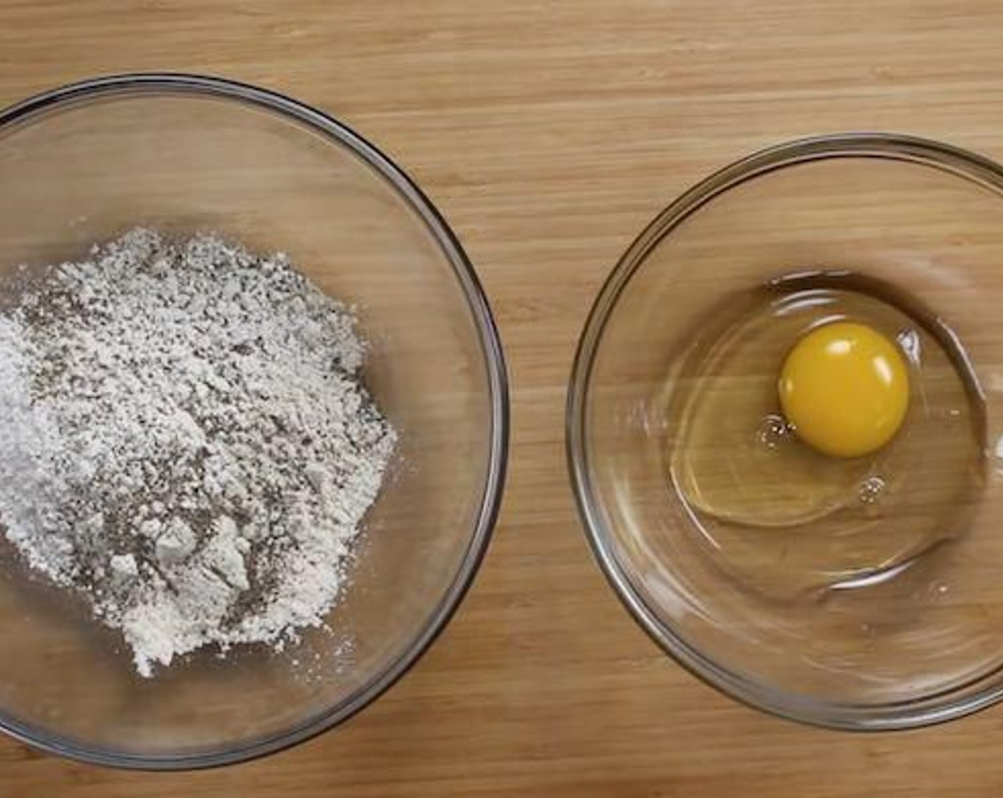 step 3 Place the Egg (1) in one bowl, and in another bowl, mix All-Purpose Flour (1/4 cup), Corn Flour (1/2 cup), Salt (1/2 tsp) and Ground Black Pepper (1 pinch).