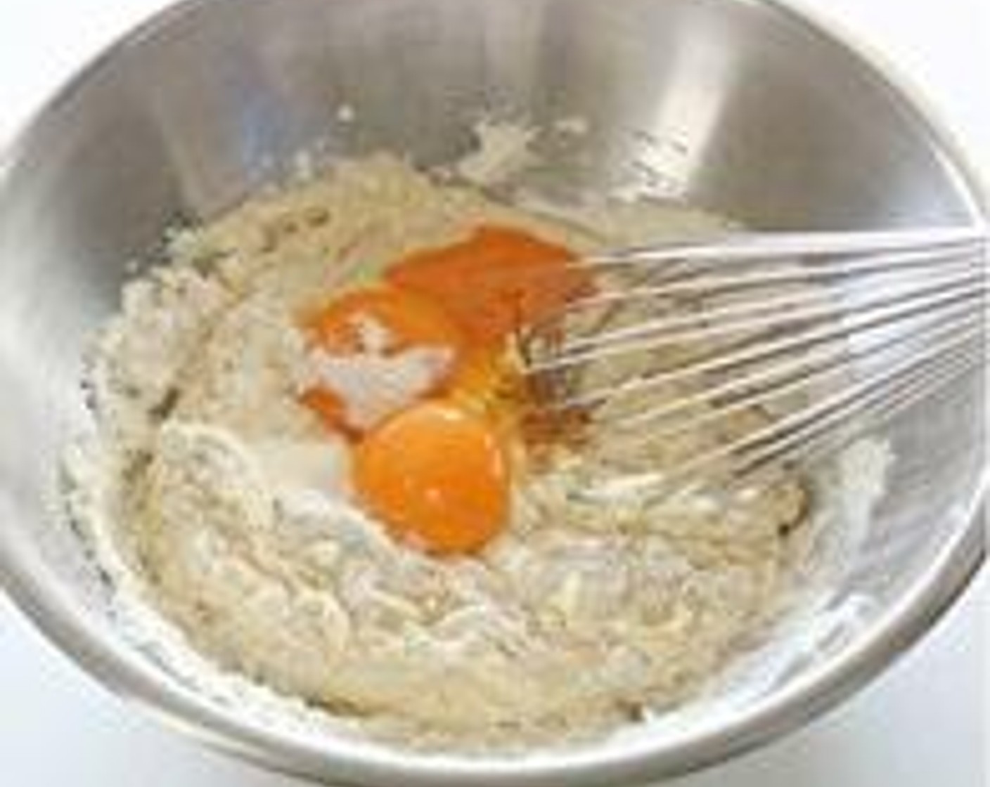 step 2 Sift Self-Rising Flour (1/3 cup) and Corn Flour (1 Tbsp) into cheese mixture. Stir and add Eggs (3) Yolks and mix to combine.