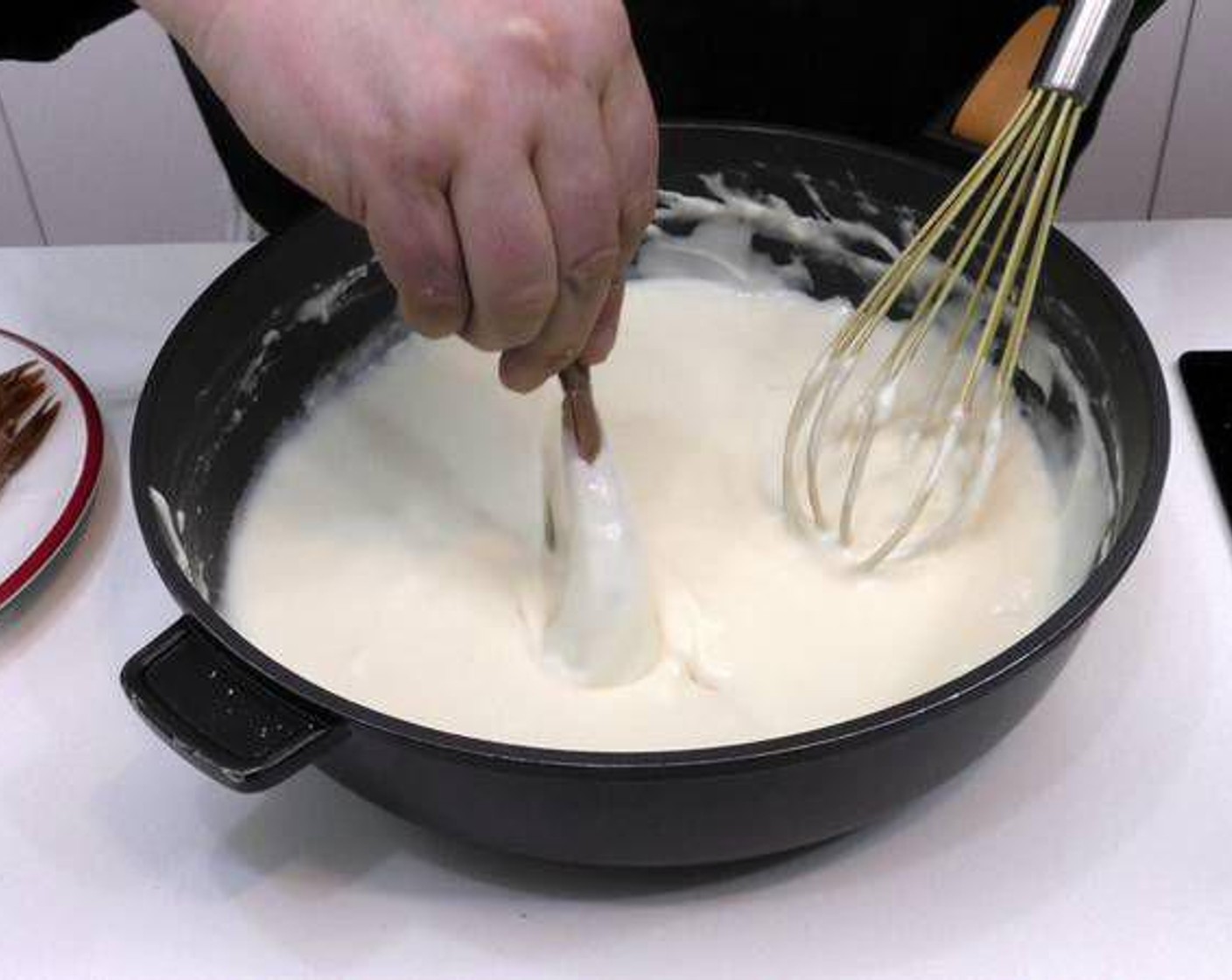 step 3 Now peel the Scampi (8) except for the tail end and dip in the béchamel sauce.