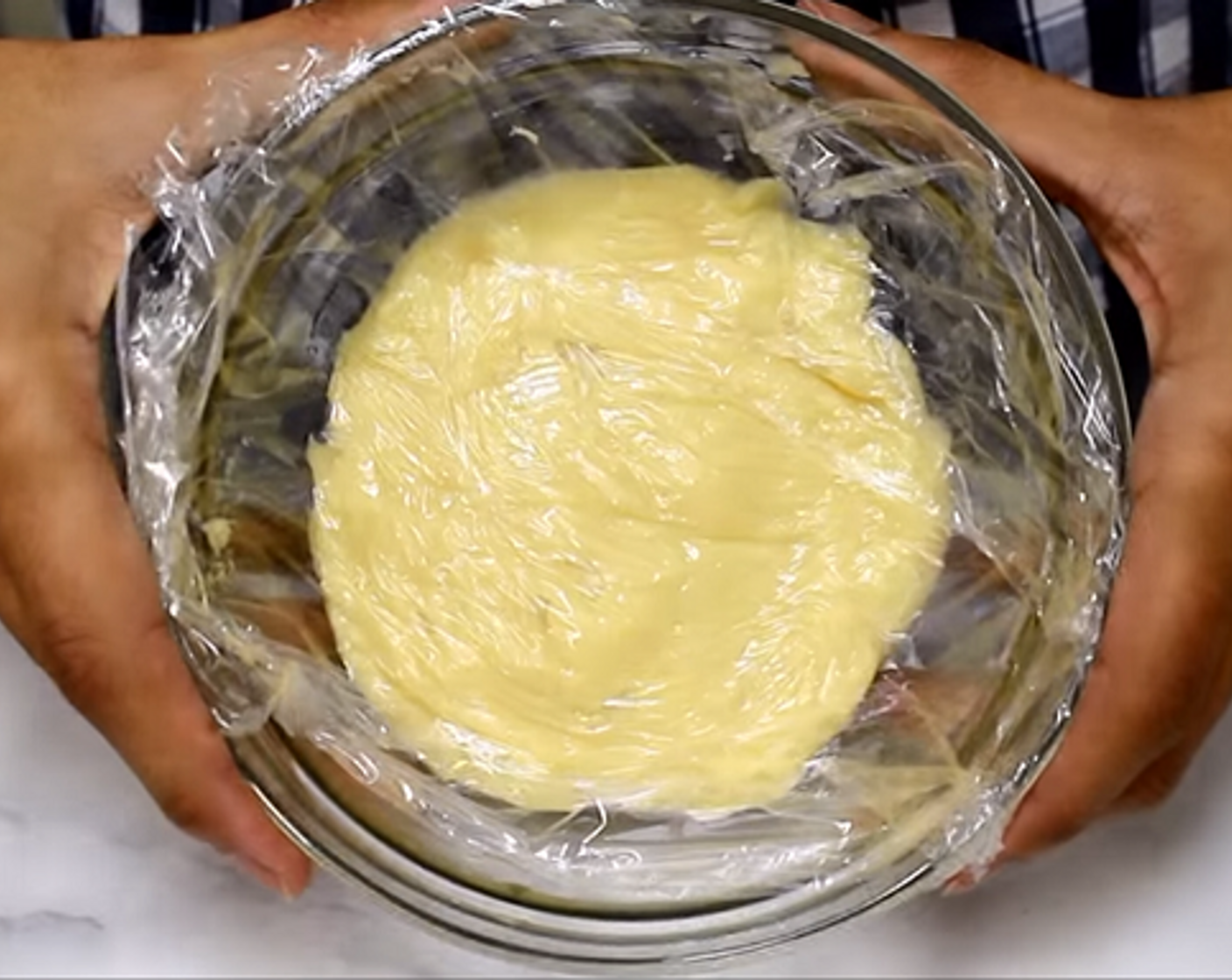step 9 Cover the custard with plastic wrap, making sure that the plastic touches the top of the mixture to prevent a skin from forming. Leave in fridge until thick.