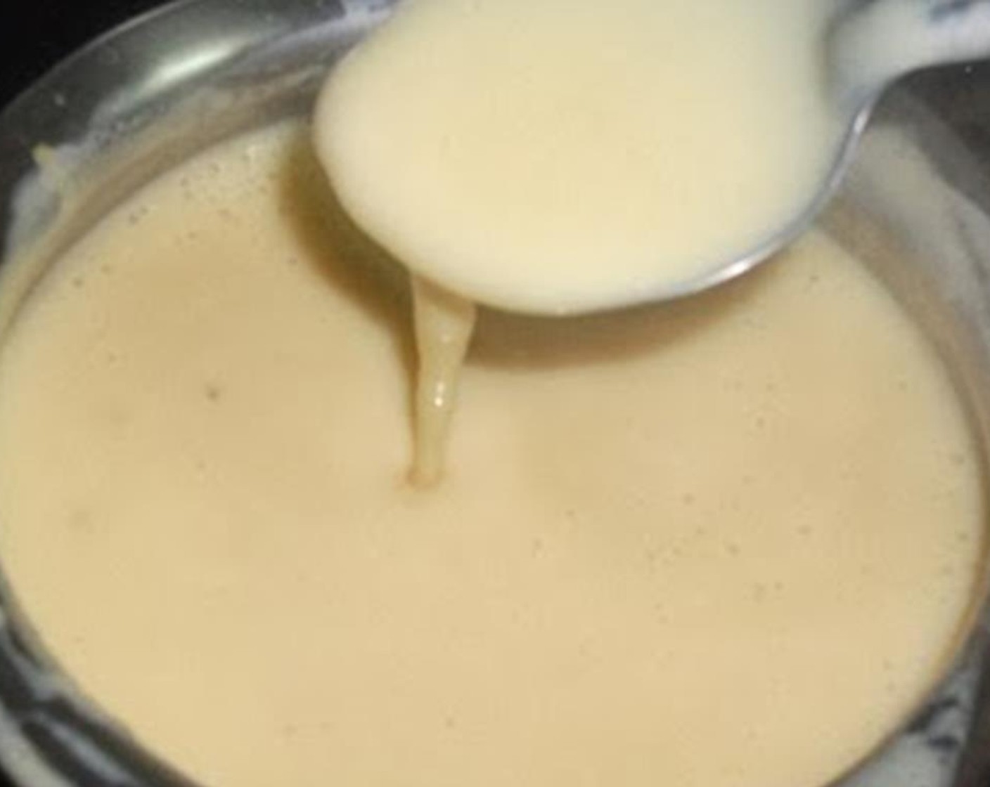 step 3 Slowly add the custard mix to the milk while stirring it constantly.
