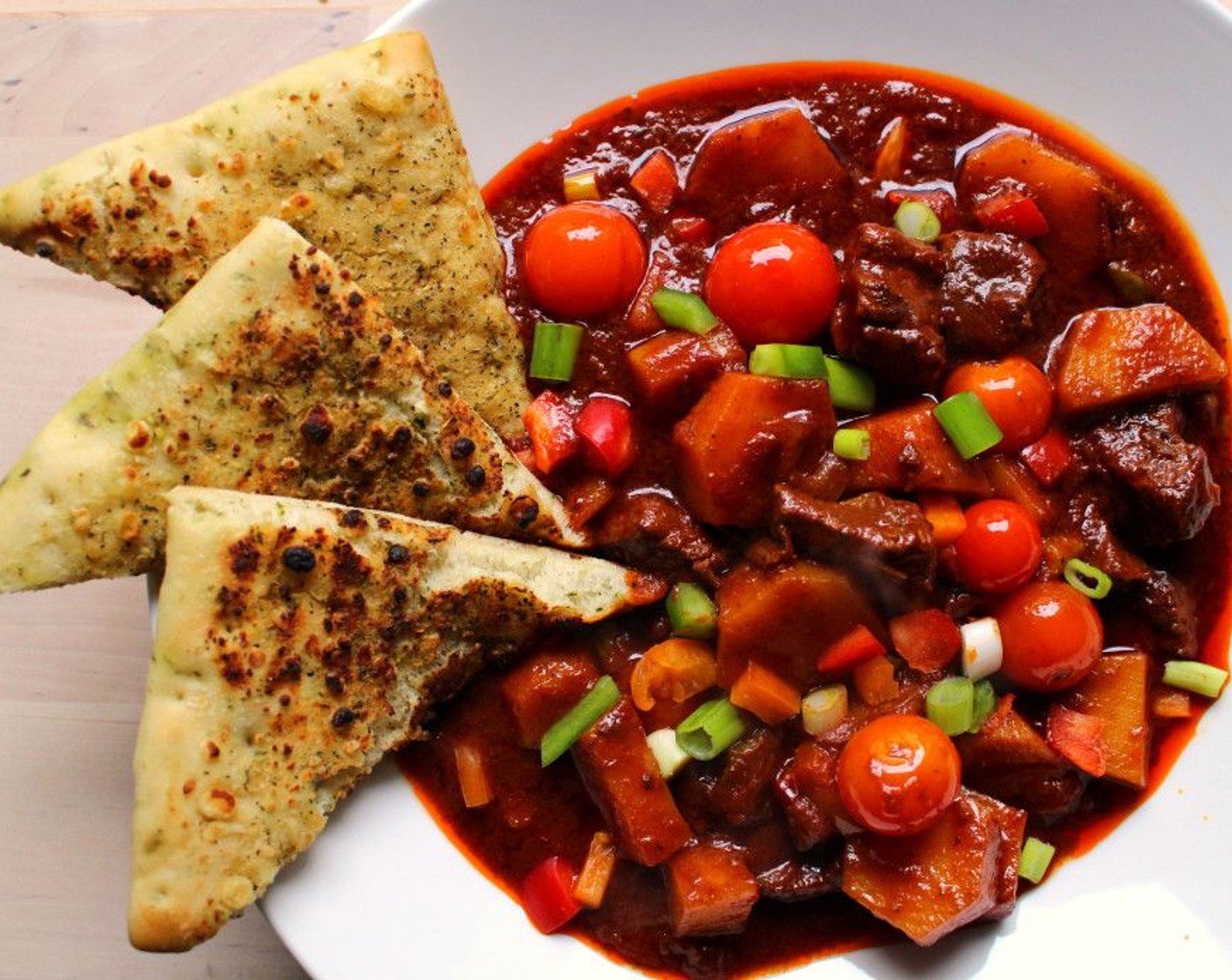 step 10 Add the grape tomatoes, scallion, Red Bell Pepper (1/2), Green Bell Pepper (1/2) and Yellow Bell Pepper (1/2). Simmer one more minute, check and adjust the seasoning. Serve hot with bread.