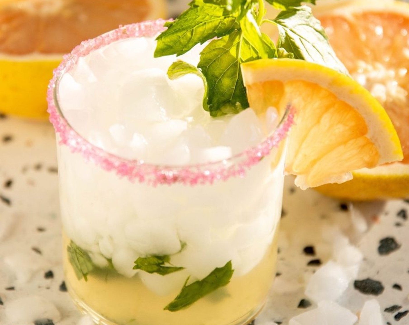 step 4 Top each cup with Ice (as needed) and Sparkling Water (as needed). Gently store and garnish with a wedge of grapefruit and some mint!