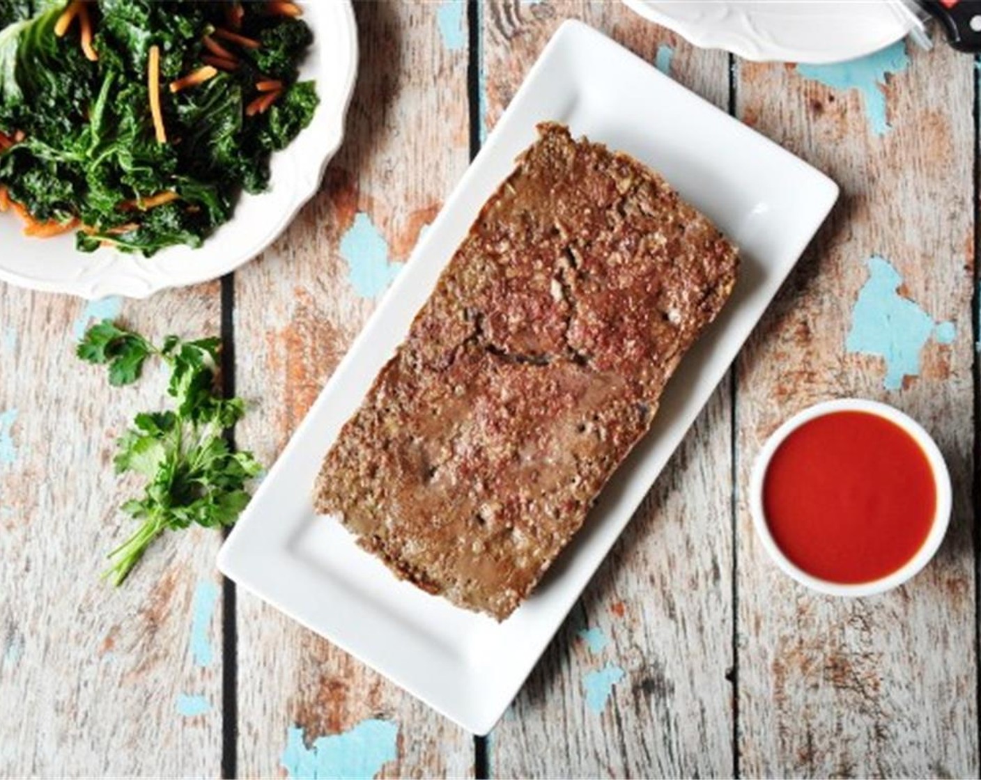 step 8 When the meatloaf is done, remove from oven. Transfer it from the loaf pan to a plate by holding the wax paper and lifting it up.