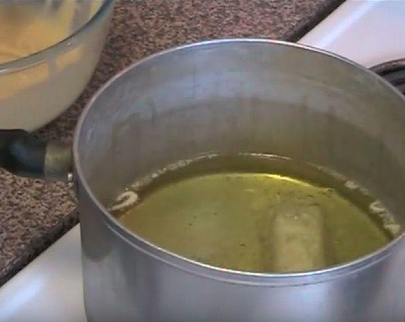 step 3 In a saucepan over medium heat, warm Vegetable Oil (as needed). Drop Mars bars into the oil. Let fry for 1-2 minutes.