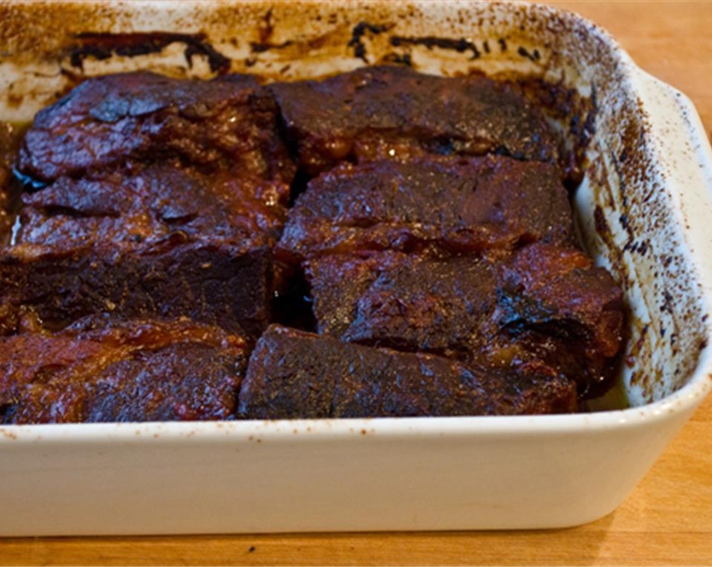 step 7 Cook for 30 minutes more, uncovered, until the meat is tender and browned. Cut off any excess fat that remains around the short ribs. Transfer the short ribs to a serving platter. Discard the cooking liquid, as it will be very greasy.