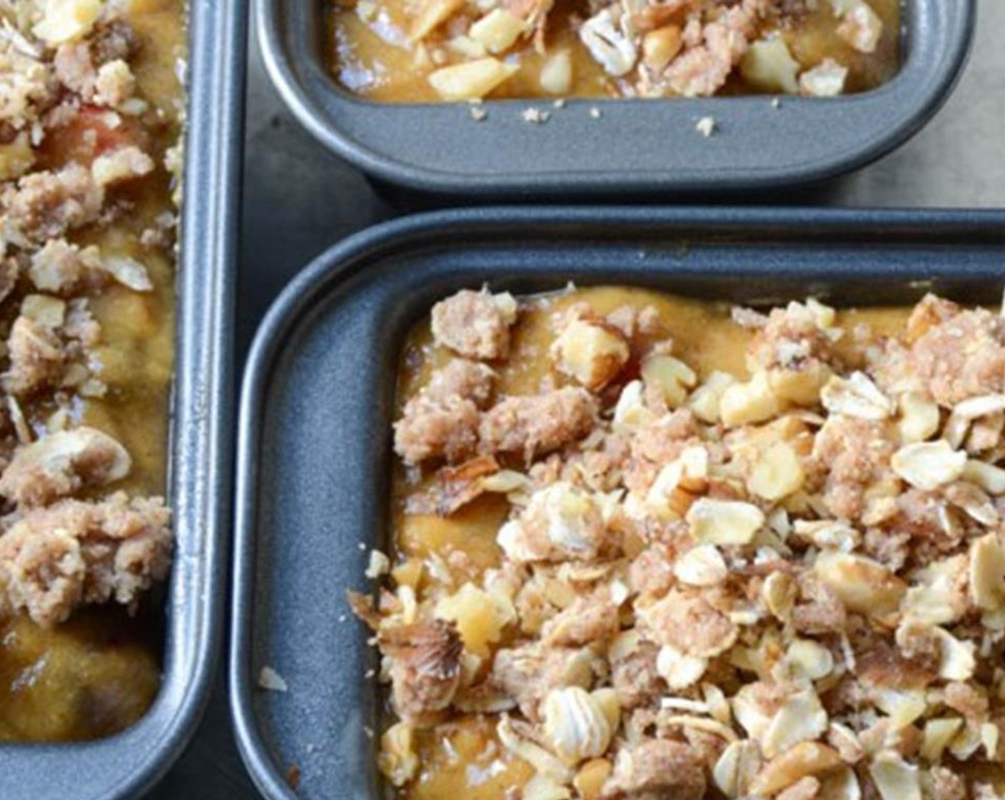 step 10 Divide the batter equally between the three loaf pans. Evenly sprinkle streusel topping over each loaf.