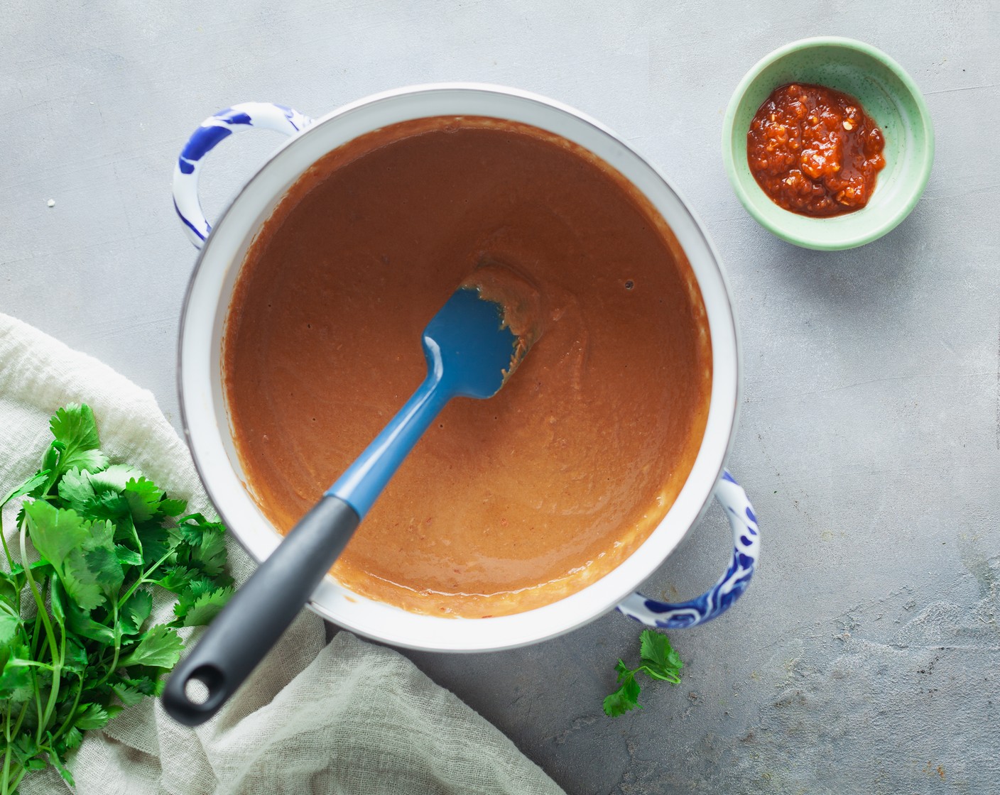 step 2 While the pasta cooks, combine the Coconut Milk (1/2 cup), Peanut Butter (1/2 cup), 2 Tbsp of Lime (1), Soy Sauce (2 Tbsp), Brown Sugar (1/2 Tbsp), and Chili Garlic Paste (1 tsp) in a small pot over medium heat. Cook, stirring occasionally, until smooth, about 5 minutes.