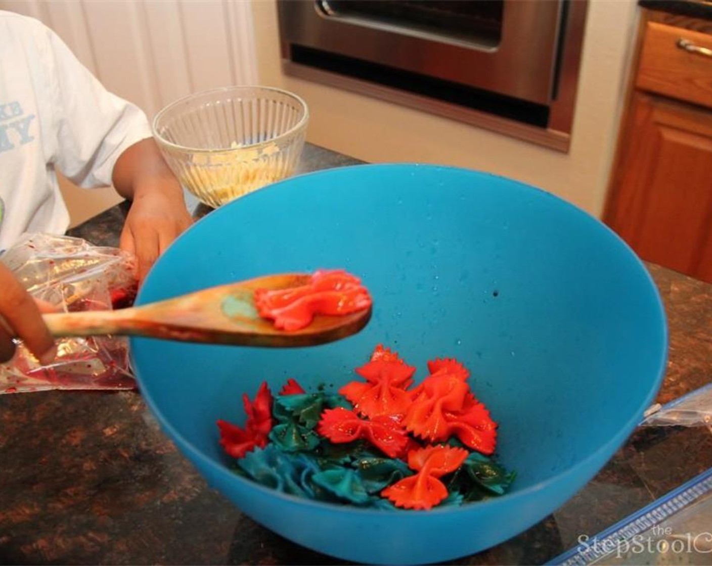 step 6 Drain and rinse colored pasta to remove excess coloring.