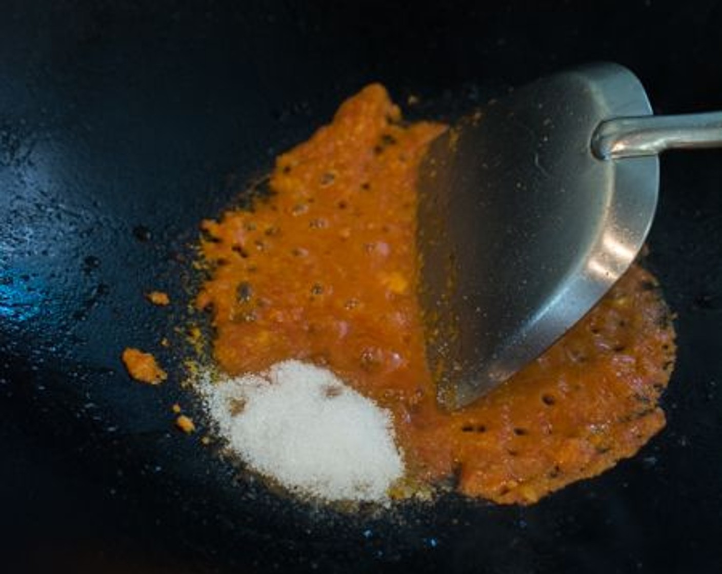 step 4 When the potatoes are ready, heat up Cooking Oil (1 Tbsp) over medium-high heat in a wok or frying pan. Pour the sambal into the wok. Fry until most of the water evaporates and it starts to thicken up.