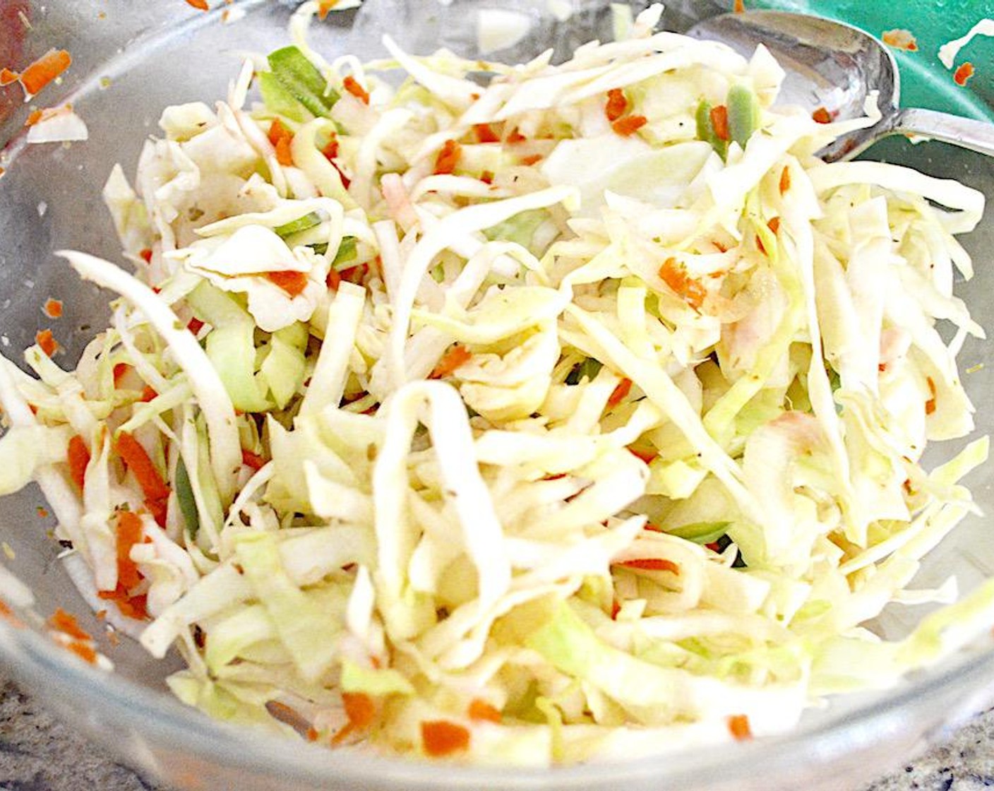 step 1 The curtido really needs to sit at least overnight, so prepare that first. Toss the Green Cabbage (1 head), Carrots (2), Jalapeño Peppers (2), Onion (1), Salt (2 tsp), Dried Oregano (1/2 tsp), and Ground Coriander (1/4 tsp) together well in a large, glass bowl that has a sealable lid.