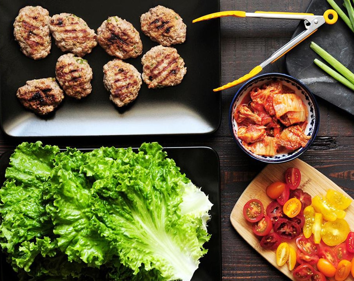 step 4 To serve, place the patties on Lettuce Leaves (8) and top with Kimchi (1/2 cup) and Cherry Tomato (1 cup). Garnish with Sesame Seeds (to taste).