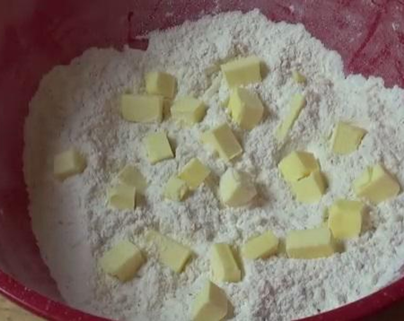 step 3 Add the Butter (1/4 cup) into the bowl. Using your hands, rub the butter and the flour together.