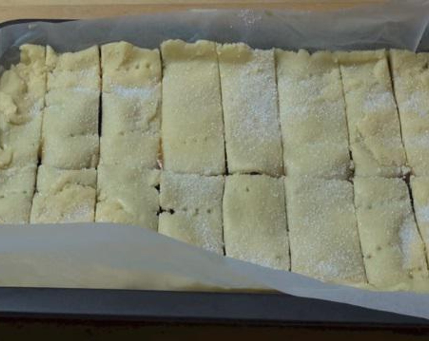step 6 Before baking, slice the shortbread into pieces. Then, bake inside a preheated oven under 350 degrees F (180 degrees C) for about 30 minutes.