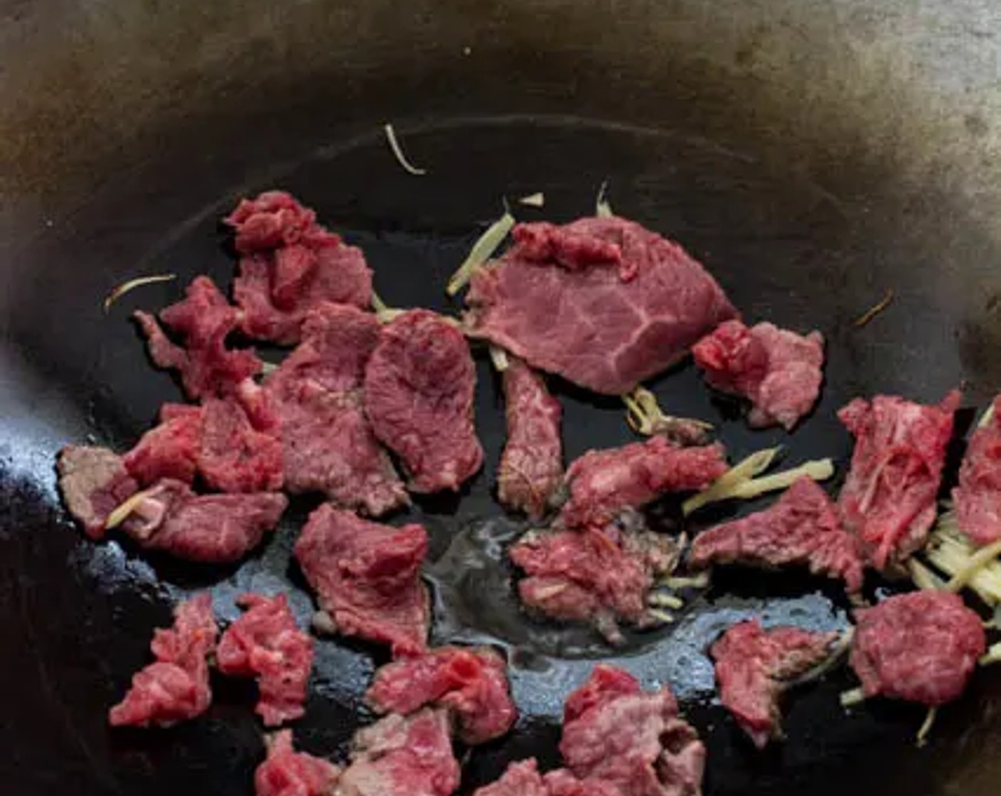 step 5 Stir-fry the beef in small batches for 1 minute, it will allow the beef to sear properly in the wok. For each batch, spread the beef out in a single layer in the wok.