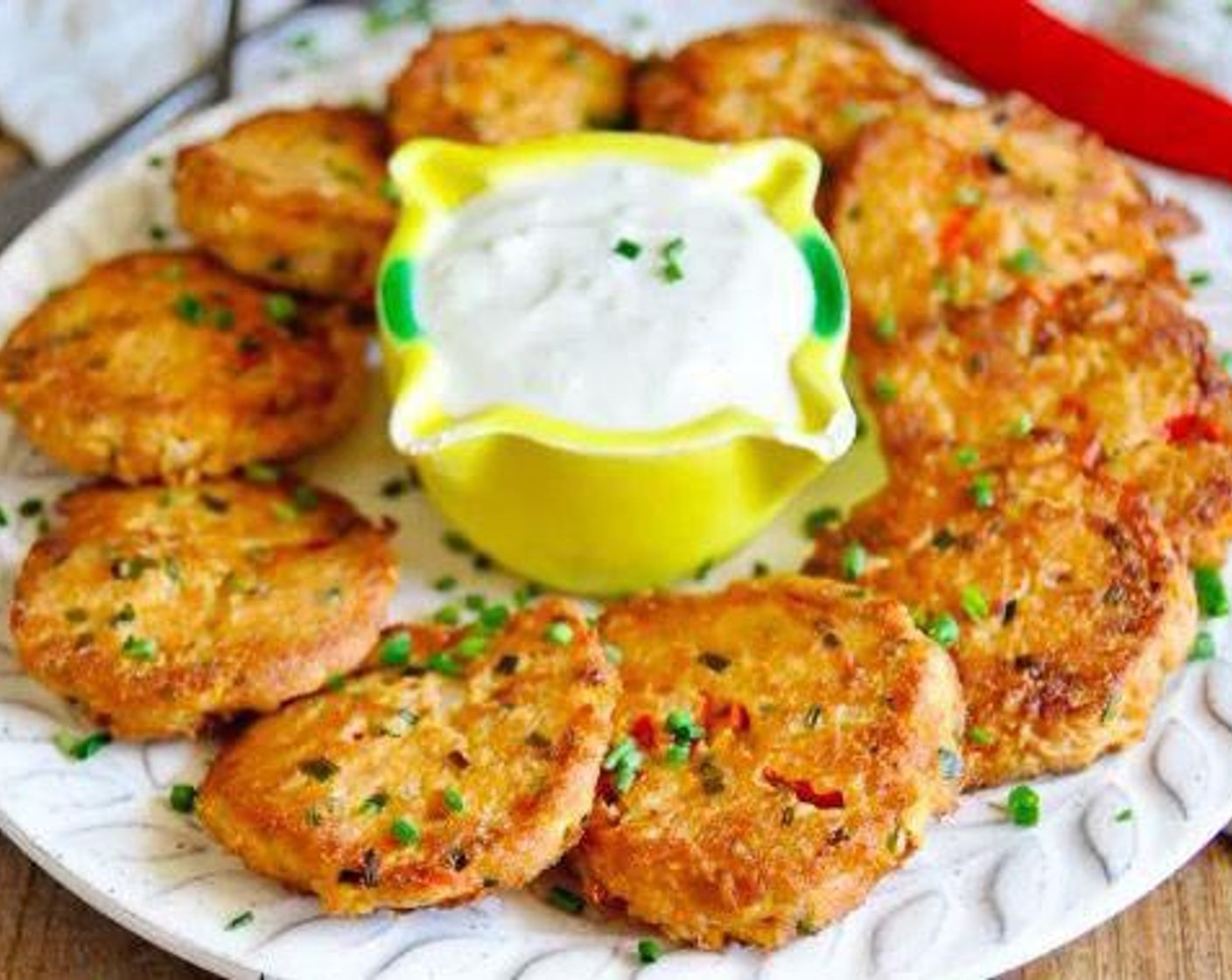 step 15 Transfer the tuna cakes into a dish and place the garlic yogurt aioli alongside to dip. Garnish with Fresh Chives (to taste). Enjoy!
