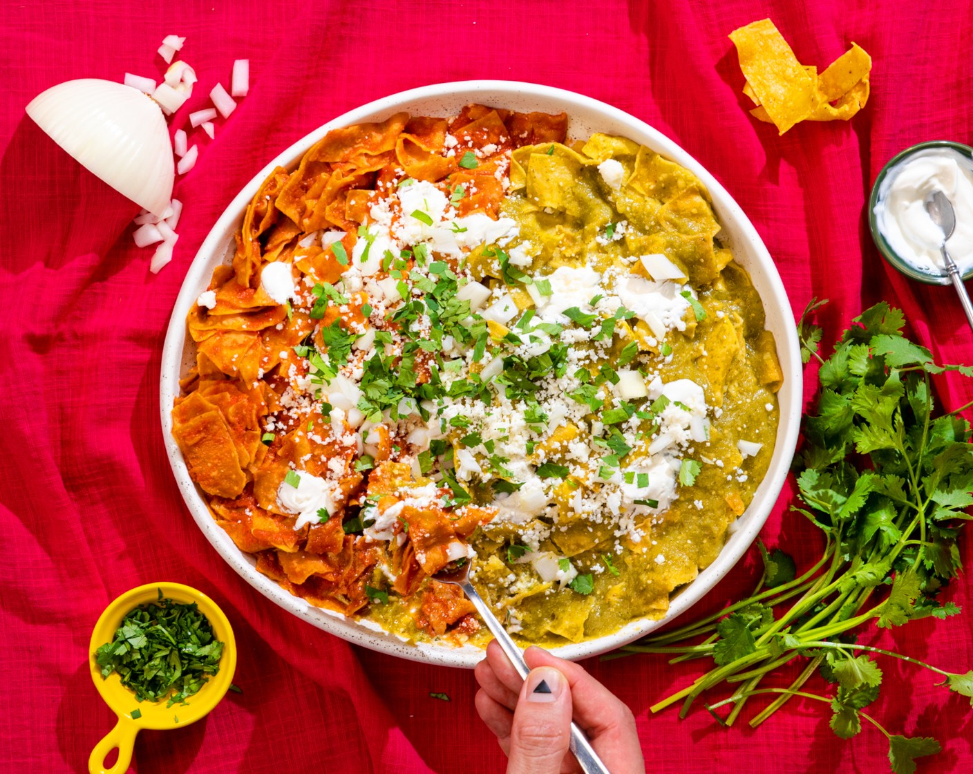 step 9 Quickly plate the chilaquiles and top with White Onions (to taste), Queso Fresco (to taste), Sour Cream (to taste), and Fresh Cilantro (to taste). Serve immediately along with the cocktails.