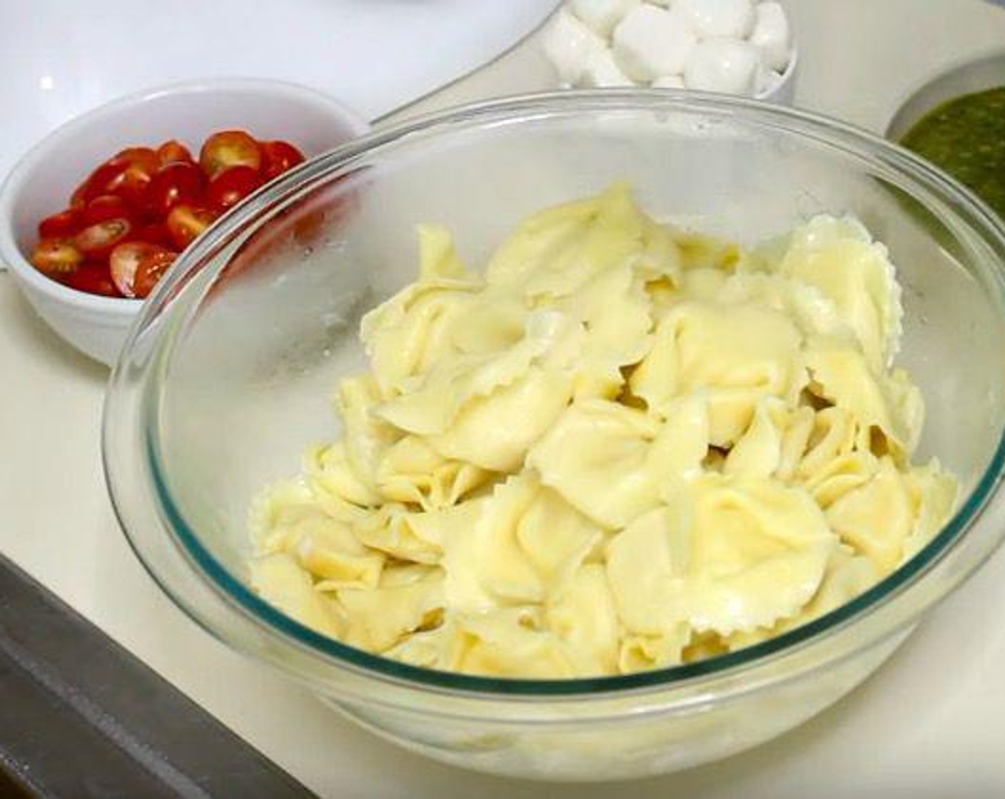 step 1 Bring a pot of salted water to a boil. Cook Cheese Tortellini (1.5 lb) according to package instructions. Drain and transfer to mixing bowl.