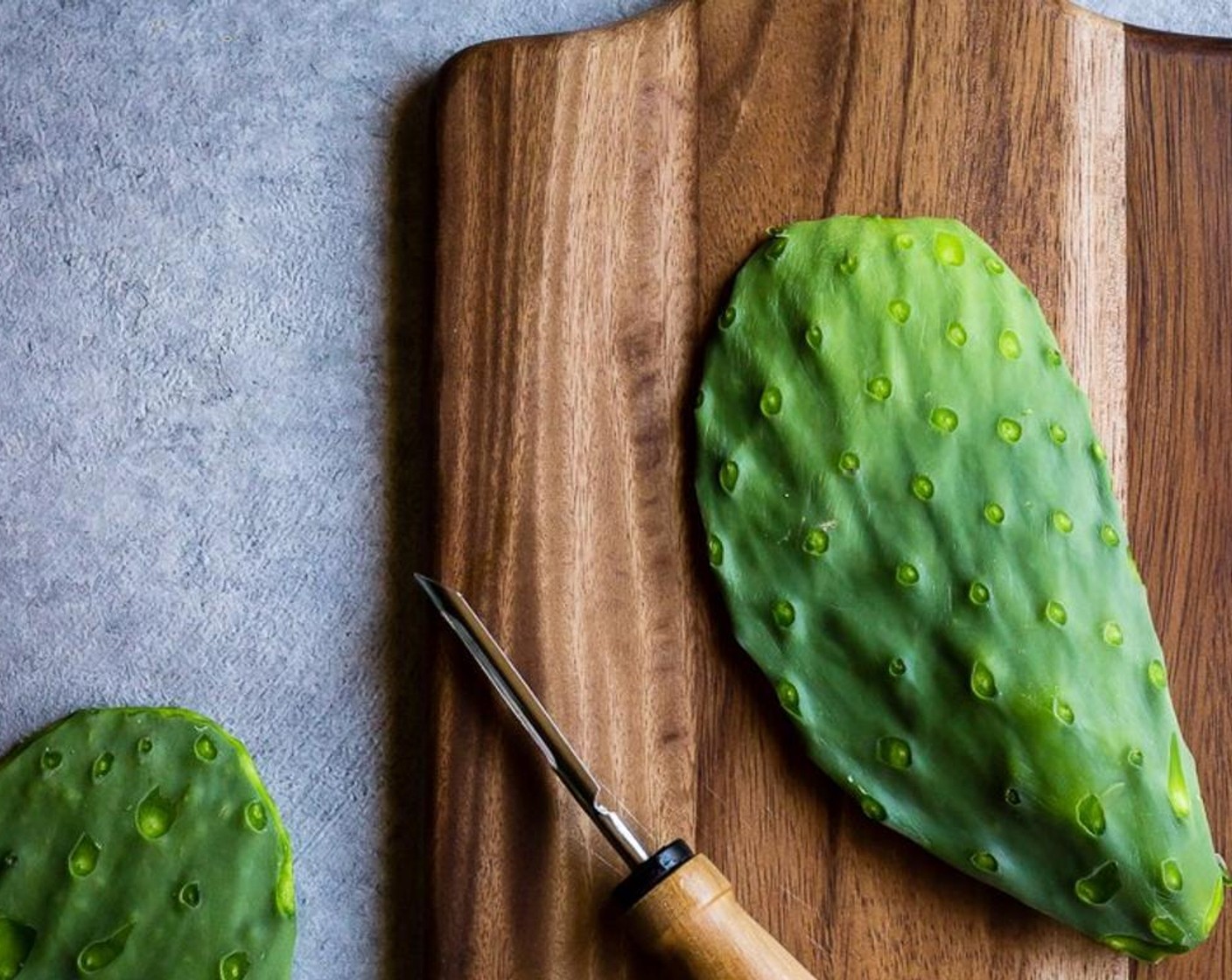 step 2 Once all of the paddles are thoroughly scrubbed, use a vegetable peeler to remove the bumps that once held the thorns from the body and edges of the paddles.