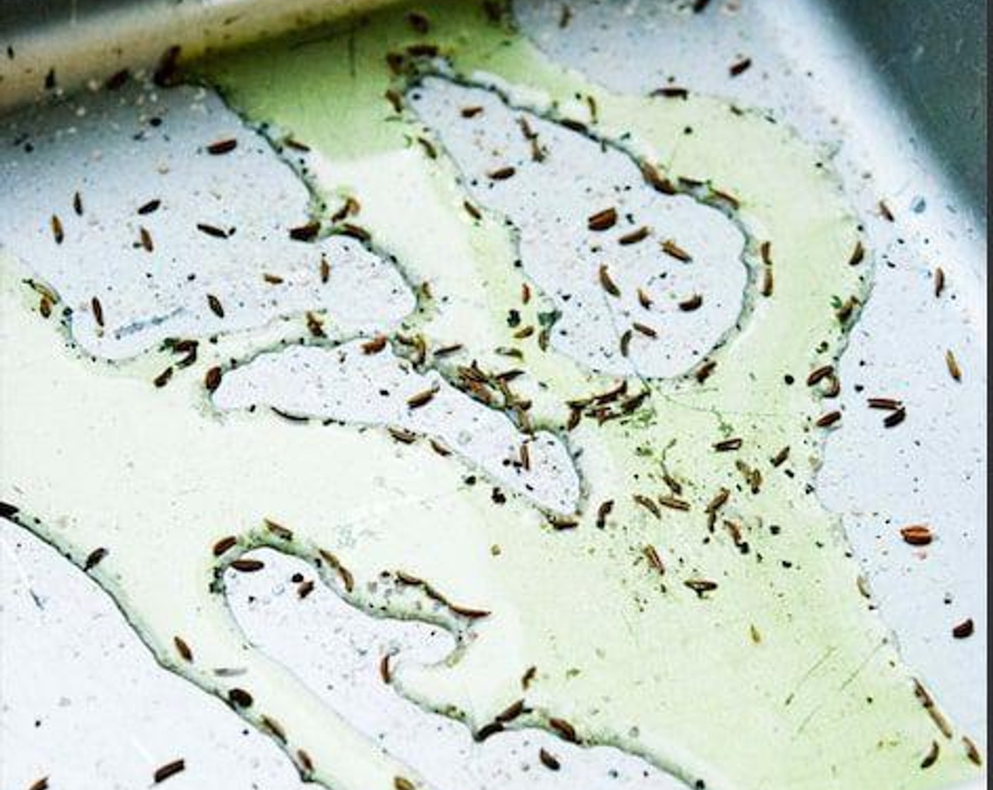 step 2 In a baking tray pour Extra-Virgin Olive Oil (2 Tbsp) and sprinkle Salt (to taste), Ground Black Pepper (to taste), and Fennel Seeds (1/2 tsp).