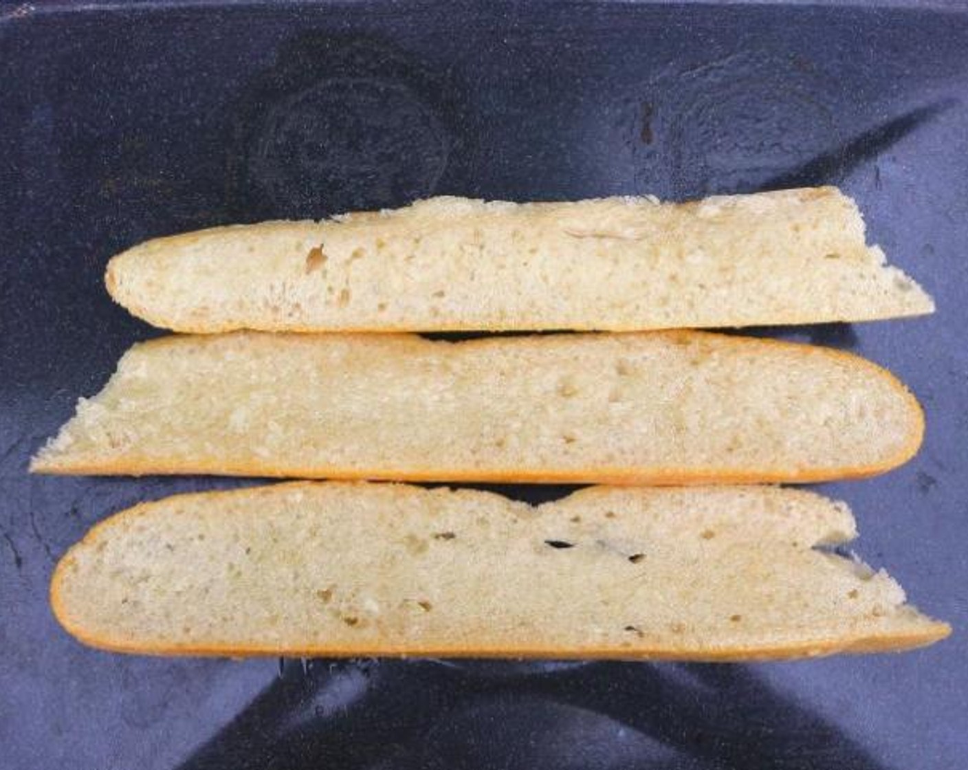 step 4 Brush the slices generously with Garlic Paste (to taste), and bake until golden and crisp.