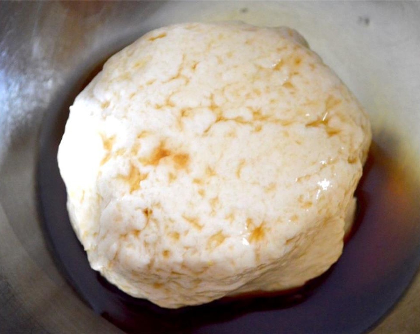 step 4 Transfer the ball of dough to a bowl and pour the Sesame Oil (2 Tbsp) over it. Make sure it is all coated in the sesame oil, then cover it and let it rest for an hour.