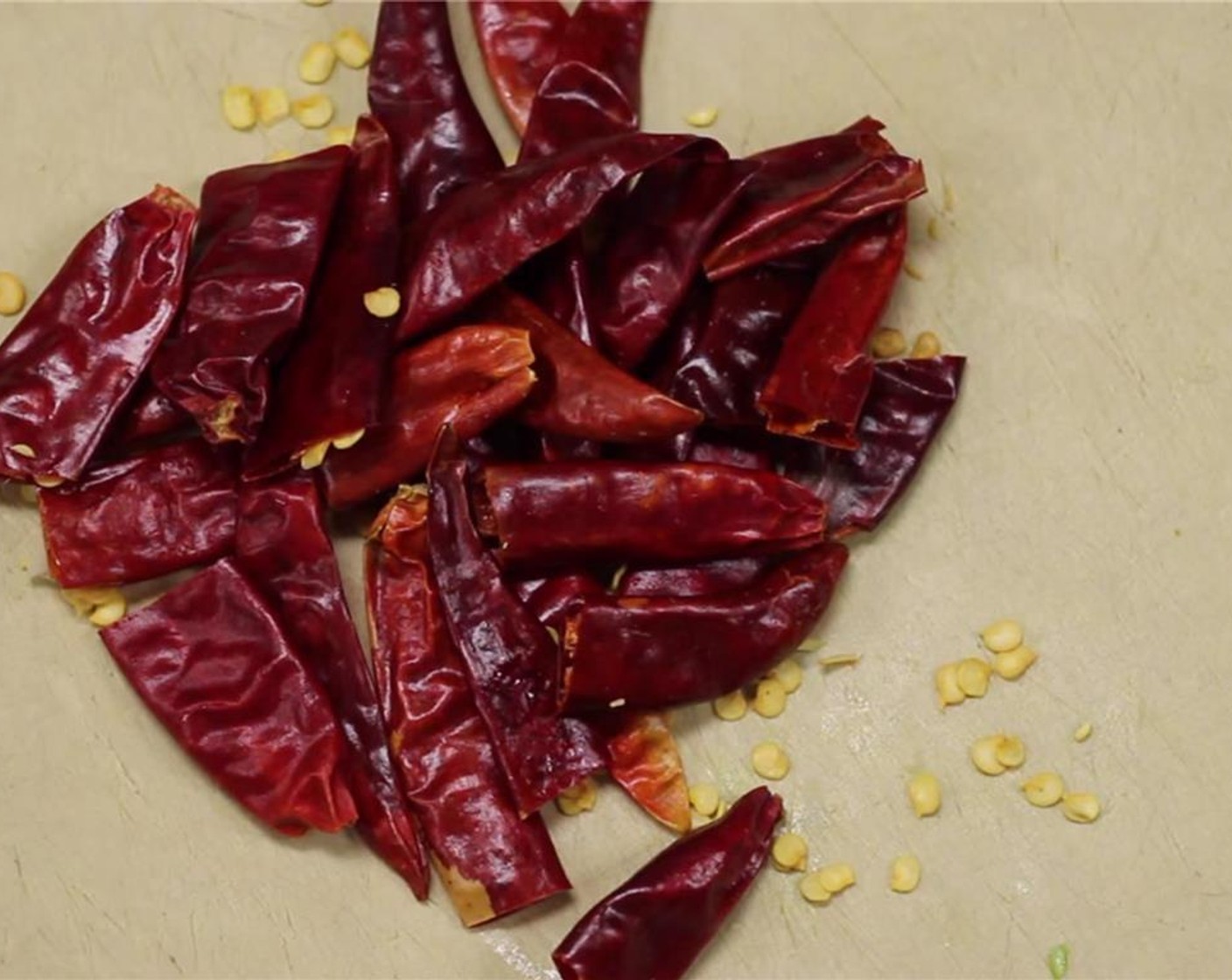 step 7 Cut Dried Chili Peppers (12) in half, discarding the seeds.