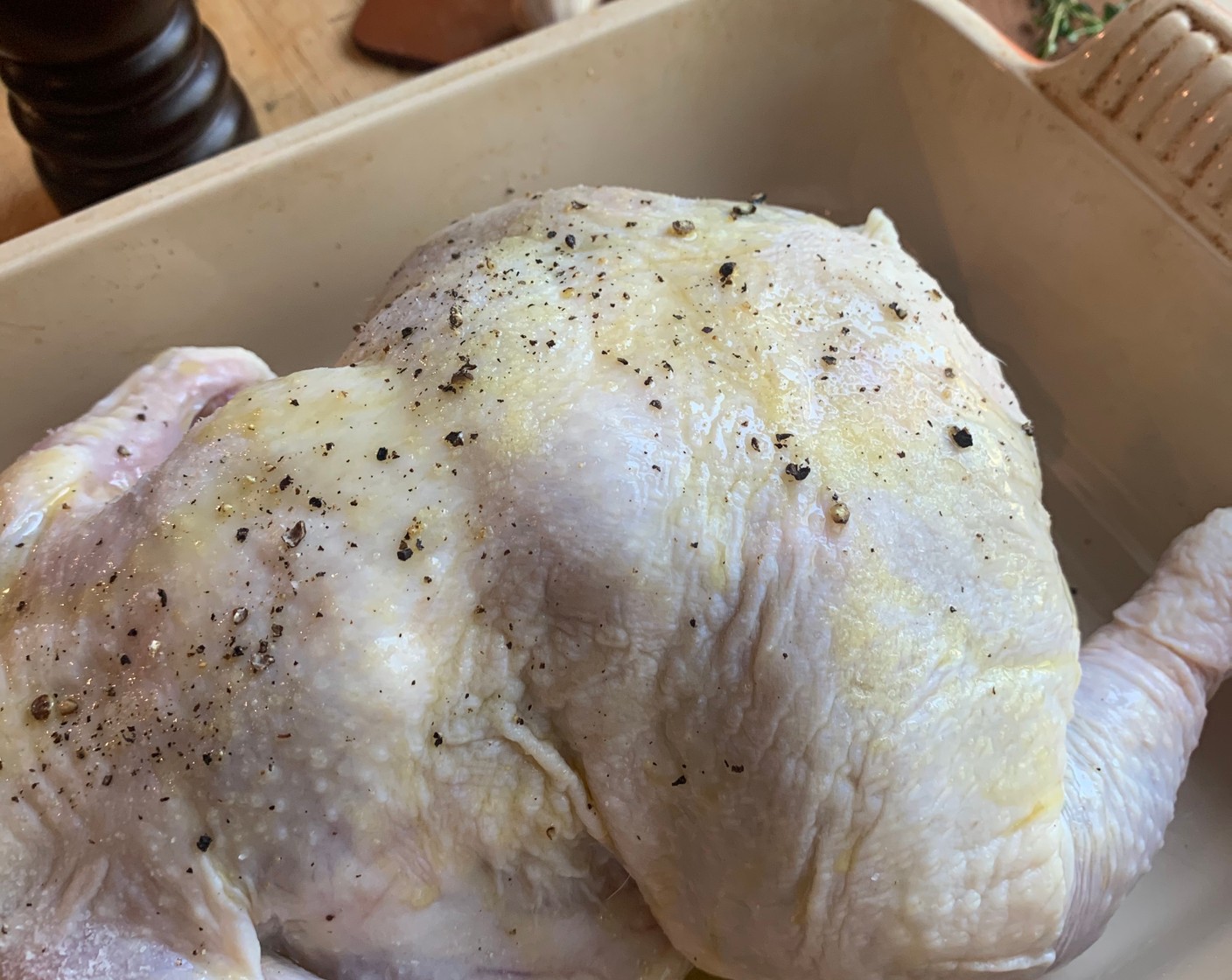 step 2 Coat the Whole Chicken (1) with Olive Oil (2 Tbsp) and season with Kosher Salt (to taste) and Ground Black Pepper (to taste).