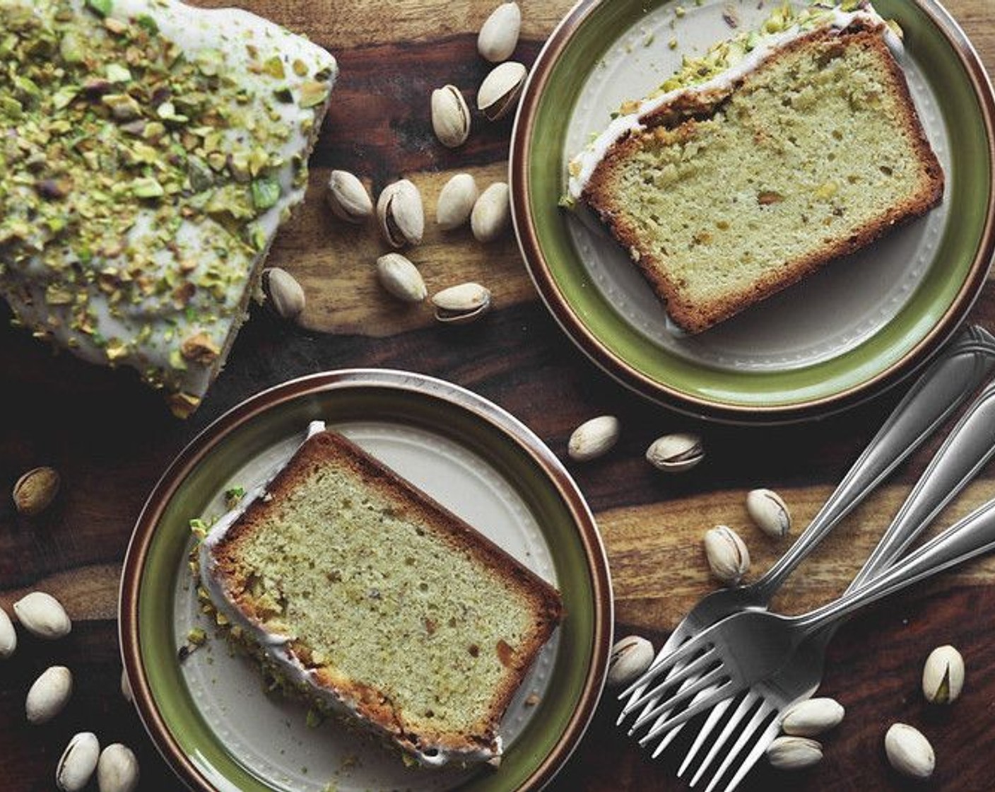step 10 Let the cakes cool on a rack for about 20 minutes. Unmold and discard the parchment paper. Allow the cakes to cool completely before frosting and topping with additional chopped Pistachios (1/2 cup). Serve right away.