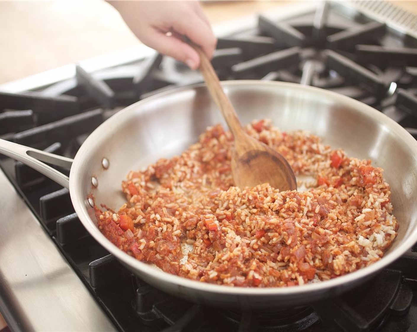 step 11 Gently fold the brown rice into the tomato mixture and hold.