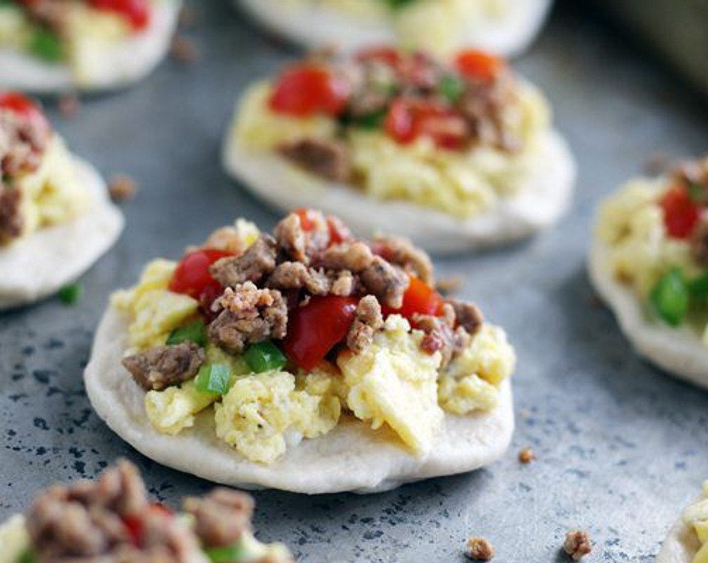 step 3 Top with the Eggs (12), Bacon (1 cup), Bell Pepper (1/2 cup), and Tomato (1/2 cup).