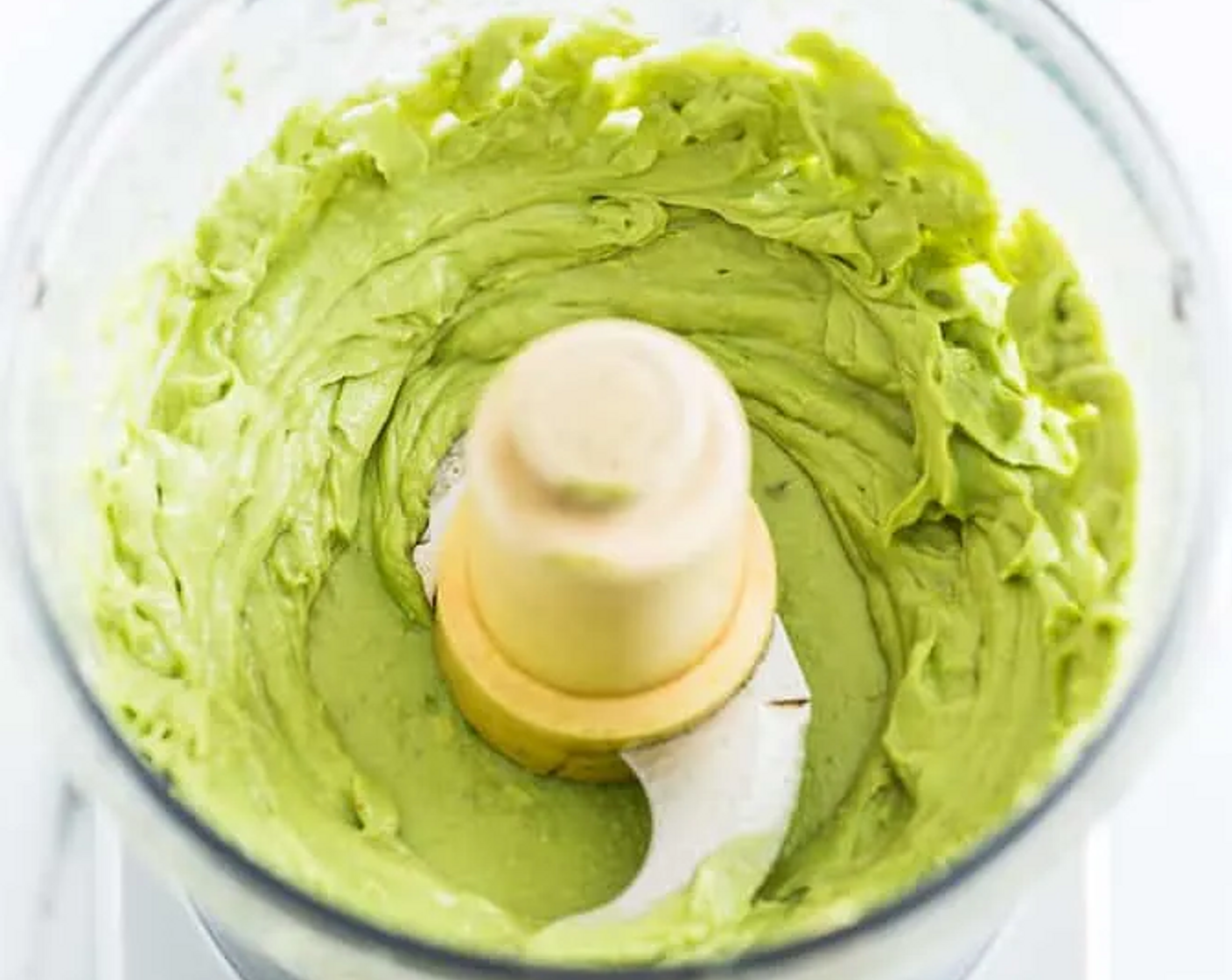 step 5 Rinse the bowl and place it back on the base with the chopping blade for the dressing. Peel the Avocados (2) and remove the pit. Place them in the food processor, add the juice from Lemons (1 1/4) and Sea Salt (1/2 Tbsp), and process until mostly smooth.