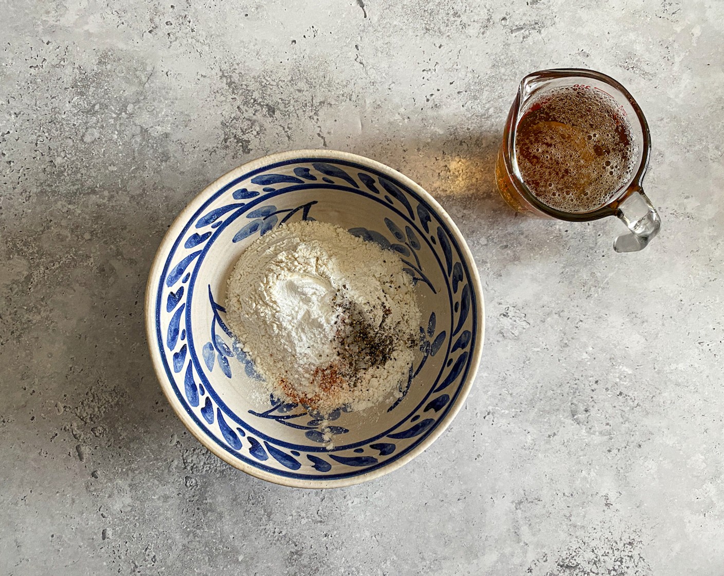 step 1 For the batter, place All-Purpose Flour (1 cup), Corn Starch (4 Tbsp), Baking Powder (1 tsp), Cayenne Pepper (1 tsp), Ground White Pepper (1/2 tsp), Salt (1 tsp), Freshly Ground Black Pepper (1 tsp) into a mixing bowl.