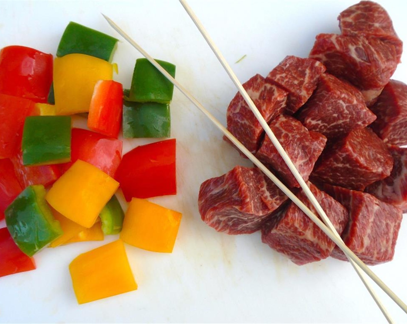 step 3 Chop the Beef Tenderloin (2 lb) and Assorted Color Bell Peppers (3) into large chunks.