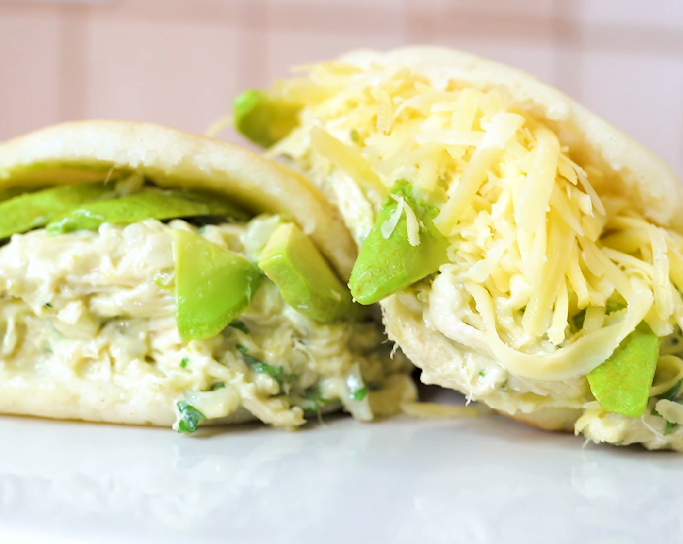 step 11 To make the Reina Pepiada, stuff your open arepa with the mixture and top with avocado slices. To make the Arepa Sifrina, add Shredded Gouda Cheese (1 cup) on top of the avocado slices.