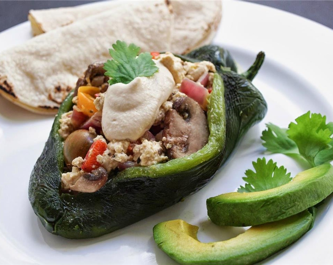 step 13 Serve with a drizzle or dollop of Sriracha Cashew Cream Sauce and Avocados (to taste). Salsa and warmed corn tortillas on the side also work well.