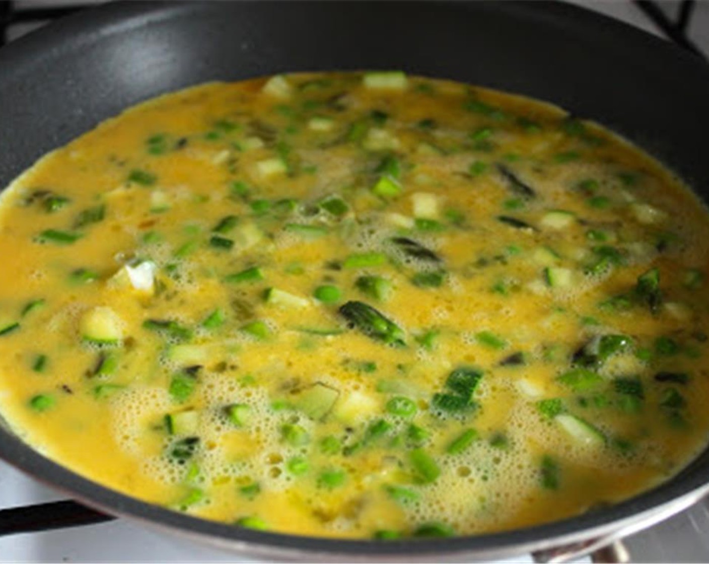 step 7 Add the eggs to the pan and immediately lower the heat to low. While your frittata is cooking, preheat the broiler.